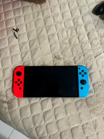 Nintendo Switch console with neon red & blue Joy-Con - used
