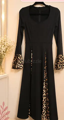 Black Long Dress with Leopard Print Details
Black long-sleeve dress with leopard-print details on th