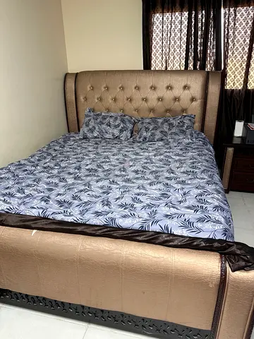Queen upholstered bed frame with padded headboard