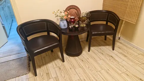 Classy set of dark wood barrel chairs with leather panels and matching centre table.