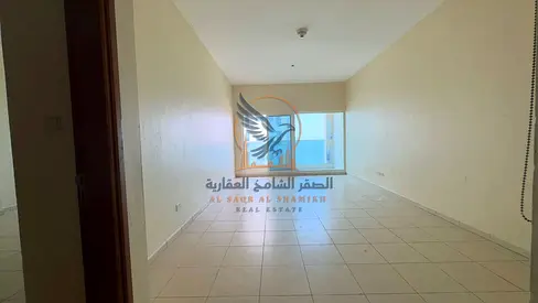 Premium 1BR apartment for annual rent with 2 baths balcony open view wardrobes private parking spacious layout prime location ready now