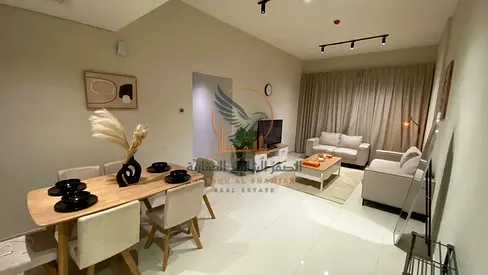 fully furnished apartment featuring two bedrooms and a living room It offers modern hotel-style furnishings and contemporary finishes