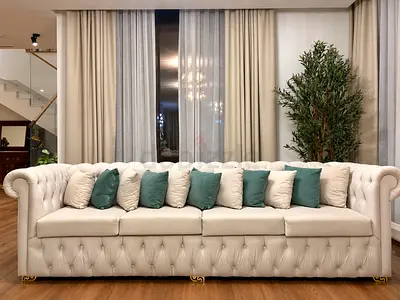 3 and 4 seater tufted cream sofas and matching coffee table.