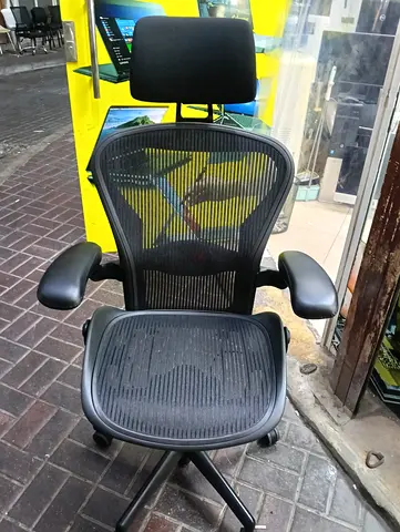 Herman Miller Aeron chair with headrest for selling.