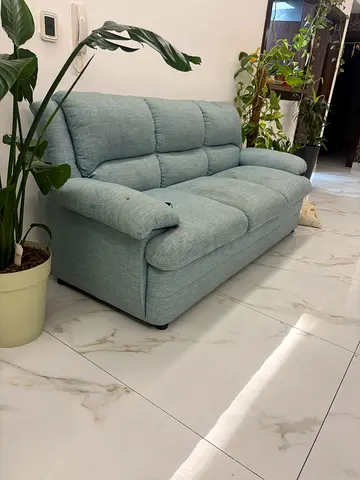 Light blue 3-seater fabric sofa in good condition