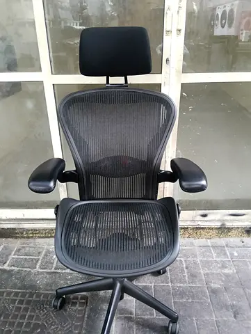Herman Miller Aeron with headrest chair for selling
