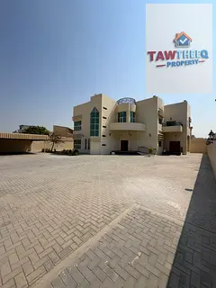 Exclusively for UAE nationals: A luxurious villa featuring central air conditioning, situated on a 1