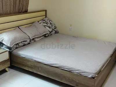 Queen wooden bed frame with headboard and side table - matress good condition..bed need to fix