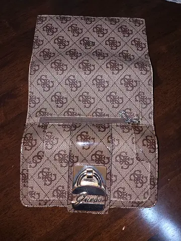Brown patterned clutch wallet with metal clasp