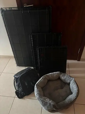 Set of pet supplies: crate panels and pet carrier - good condition .