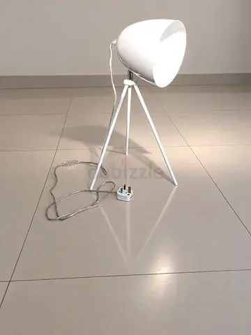 White tripod floor lamp with adjustable head — modern design