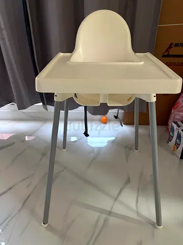 Simple white baby high chair with tray and detachable seat