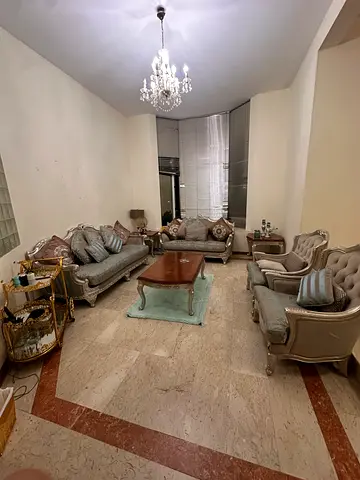 ELEGANTLY DESIGNED SOFA WITH ALL DECORATIONS INCLUDING TABLE