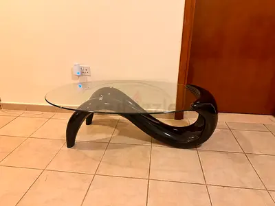 Modern Sculptural Glass Top Coffee Table with Curved Black Base