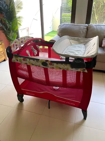 Red Graco Pack 'n Play / Playpen with Bassinet and Toys - Good Condition