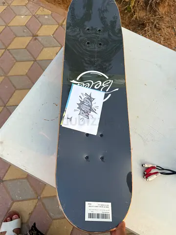 Almost-new skateboard deck with grip tape