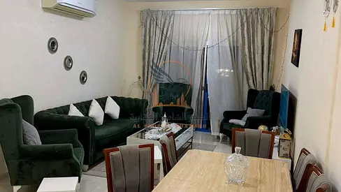 One-bedroom apartment with a living room, clean and tidy furnishings, for monthly rent in Ajman, Al Rawda 2 area.