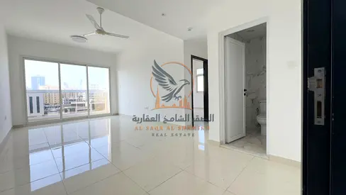 Ajman Al Rashidiya 2, one-bedroom apartment, first occupancy, excellent size, high-end finishing, central air conditioning, and two balconies.