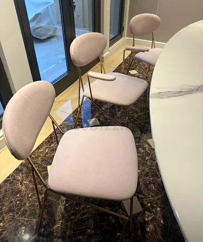 Set of 6 modern dining chairs with light beige pink fabric and gold metal frames