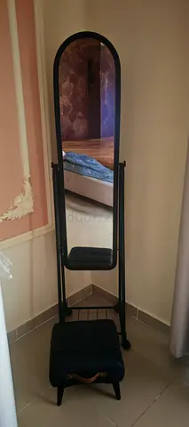 Full-length freestanding mirror with cushioned stool — black frame