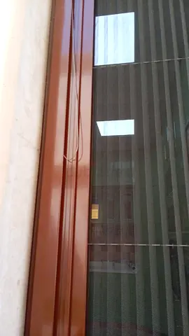 Sliding mosquito screen door insert — brown frame, good condition
