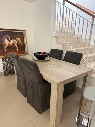 Solid wood-look dining table with 4 upholstered chairs - perfect condition- European couple used