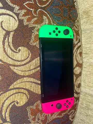 Nintendo Switch console with neon green & pink Joy-Cons - good condition
