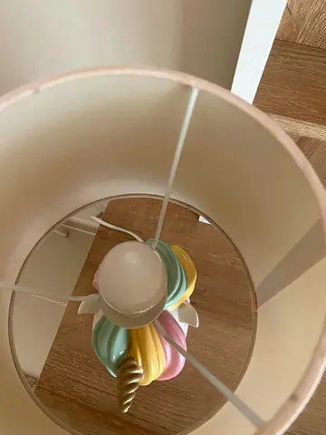 Table lamp with pastel unicorn base and cream shade