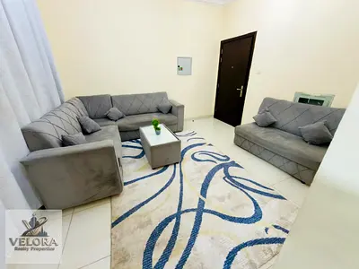 Now available in Al Rawda Building: a furnished one-bedroom apartment (with a living room). The unit features two bathrooms, a balcony, and central ai