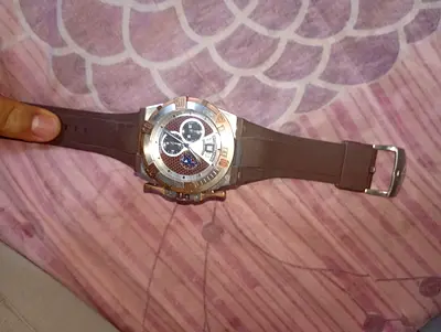 Men's brown strap chronograph wristwatch with silver bezel