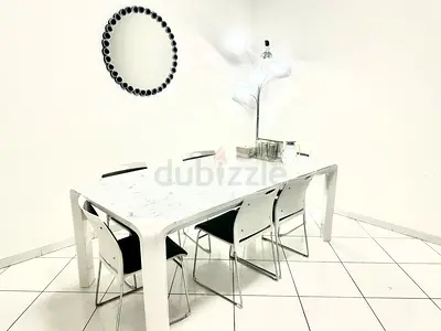 White dining table with 6 chairs
