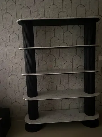 Modern marble-effect open bookshelf with curved shelves