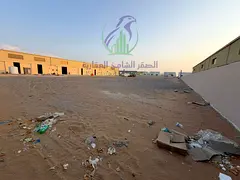 Open yard for annual rent in Al Sajaa, Sharjah, covering 48,438 sq. ft., with payment available in 4