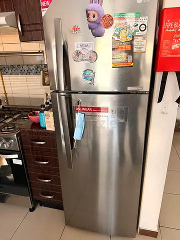 Stainless steel double-door refrigerator in good working condition