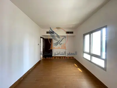Two-bedroom apartment with a living room for annual rent in Ajman, Al Rashidiya 1 area, next to Al Rawabi Market and behind Pearl Towers.
