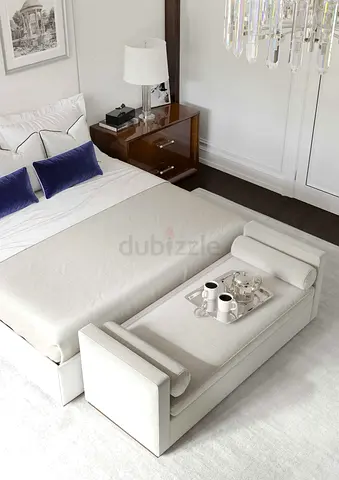 Modern upholstered bedroom bench with built-in tray at foot of bed