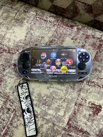 Sony PS Vita 1000 with charger and 124gb sd card