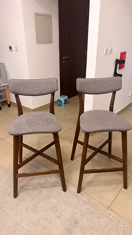 Set of 2 wooden bar stools with grey upholstered seats — good condition