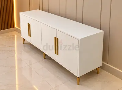 White modern sideboard cabinet with gold handles and legs
