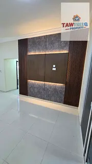 Two rooms and a living area, balcony, spacious, Al Jurf