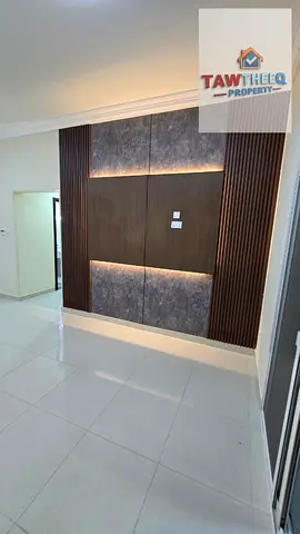Two rooms and a living area, balcony, spacious, Al Jurf