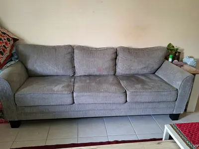 Grey 3-seater fabric sofa in good condition ( available by 5-7th Nov)