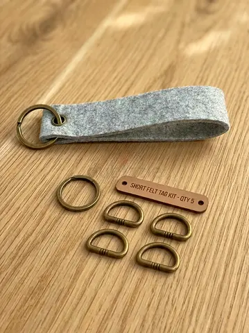 Handmade grey felt keychain kit with brass fittings. Description: Lightweight and durable felt bl