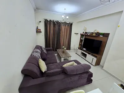 L-shaped purple fabric sofa set and coffee table