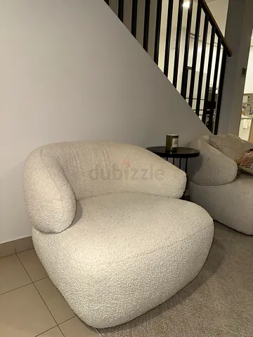 Two Cream boucle lounge chairs - cozy curved armchairs