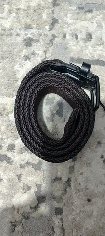 Brown woven belt with black buckle — good condition