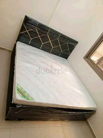 Queen bed frame with mattress — good condition, headboard design