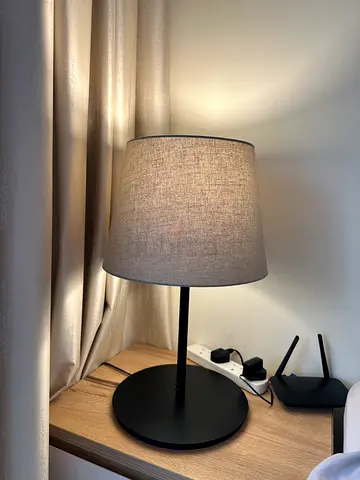 Simple grey fabric bedside table lamp with black base