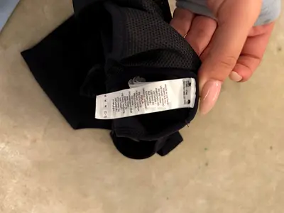 Black sports bra, size tag shown - gently used