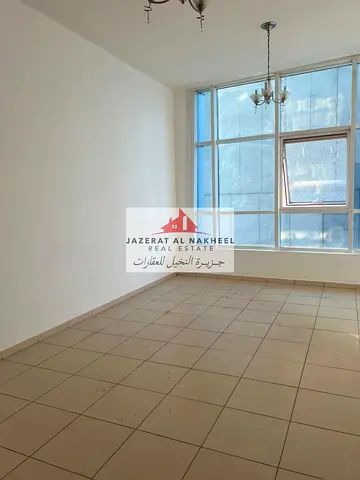 One-bedroom apartment with a living room, located in a prime area within the distinctive Al Nakhla 1 tower; offered at an attractive price with an uno